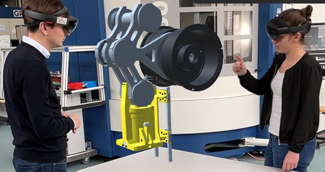 Zwei Ingenieure mit Mixed-Reality-Brillen betrachten den Digitalen Zwilling einer Baugruppe in Originalgröße